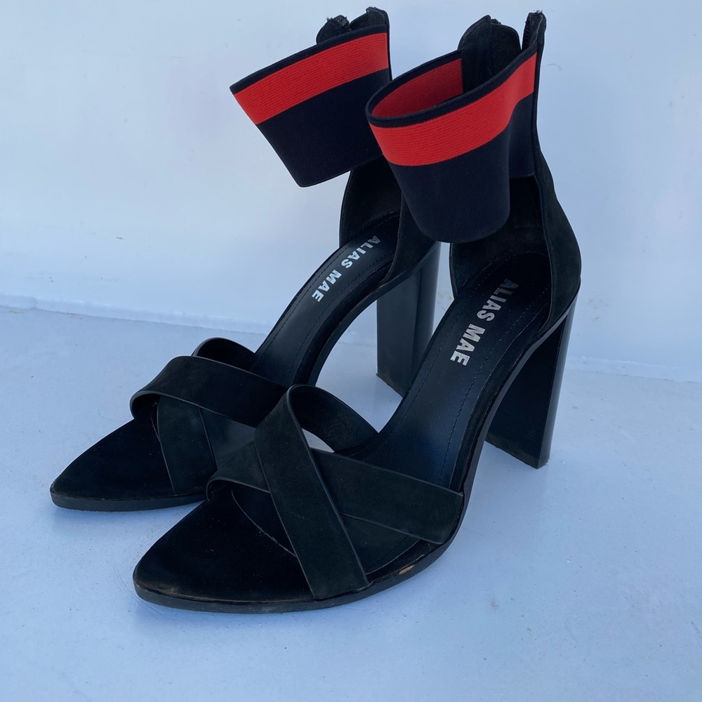 Black heels with red ankle strap